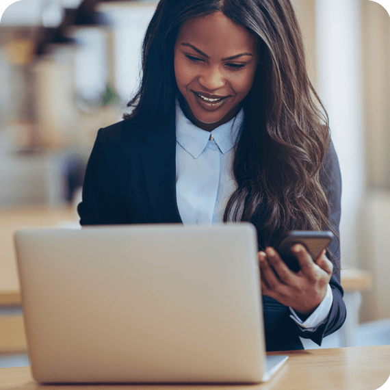 woman-business-laptop-phone-smiling